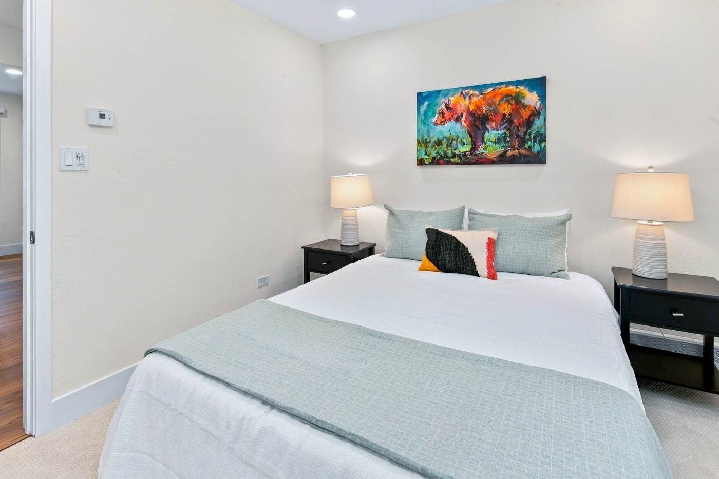 Second bedroom with artwork
