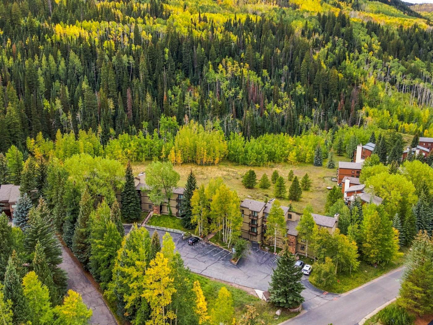 Aerial view of the property and parking