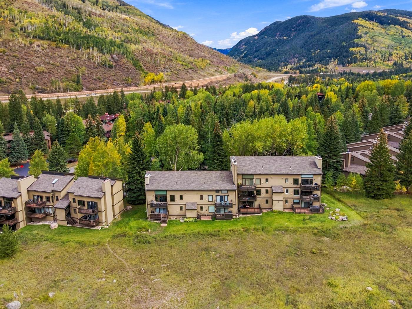 Aerial view of the building and meadow